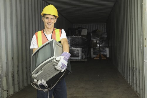 Inspector measuring office waste volume for a free quote